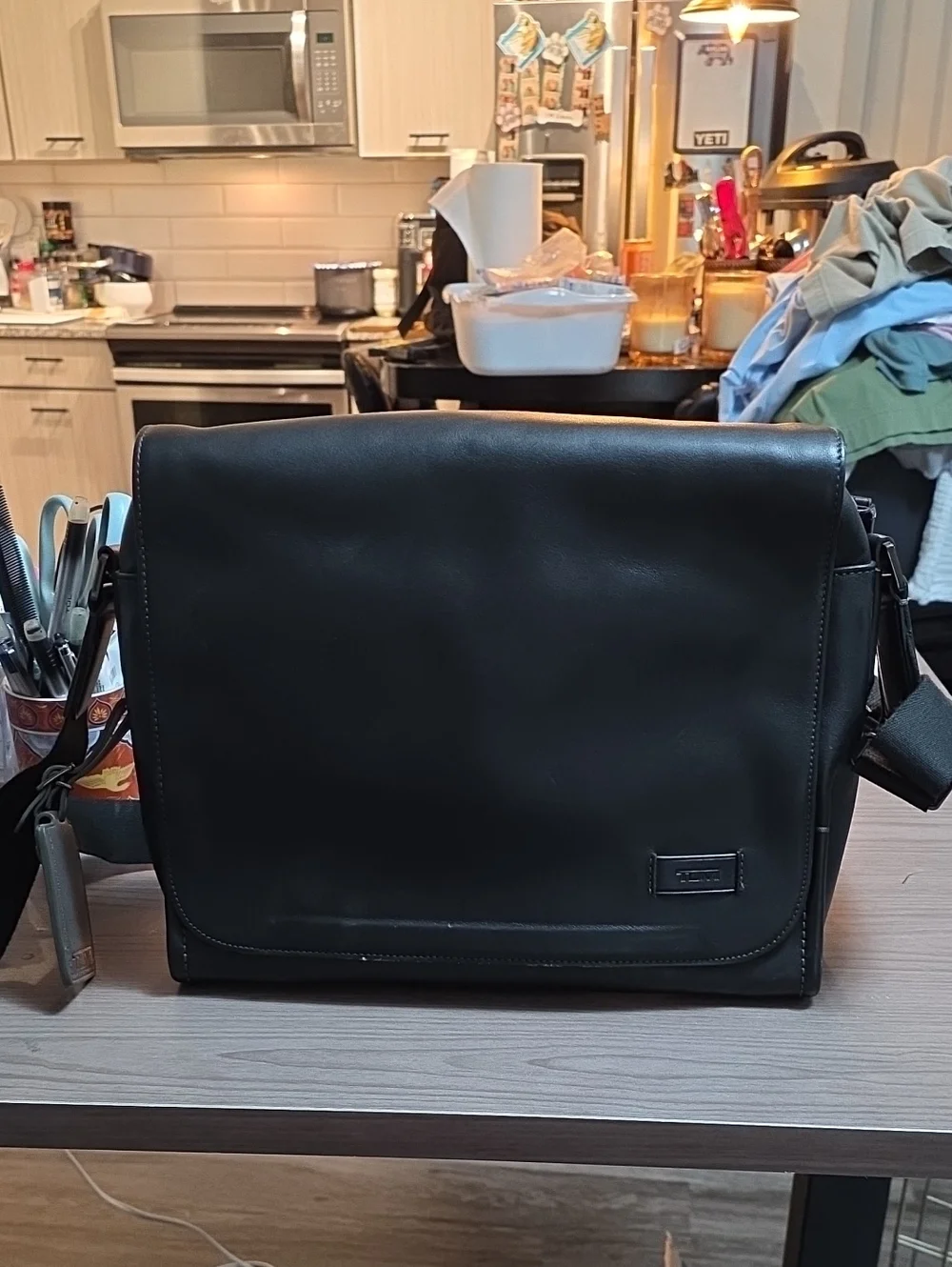 Tumi Black Leather Messenger Bag with Adjustable Strap